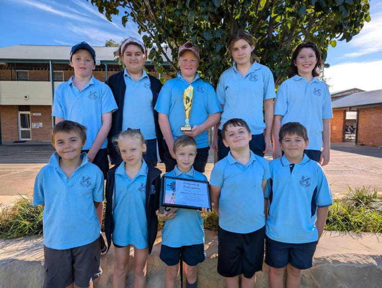 10 students posing with our school trophy and certificate from the Film Festival