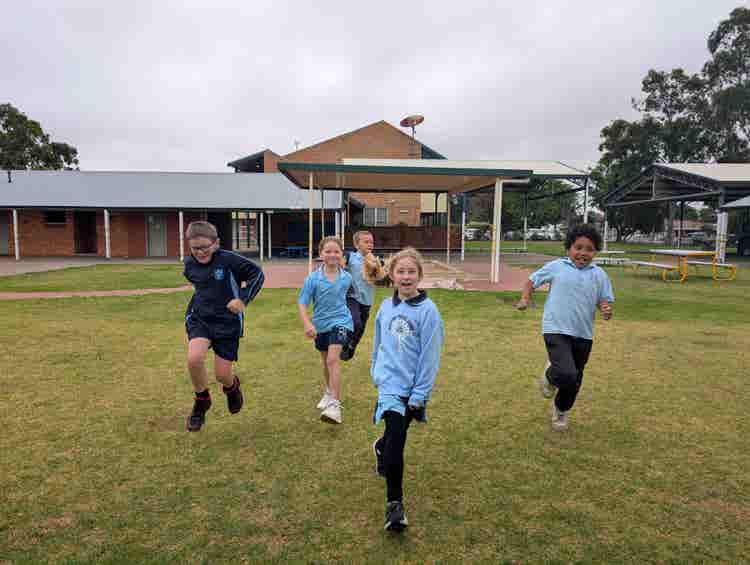 5 students running towards the camera